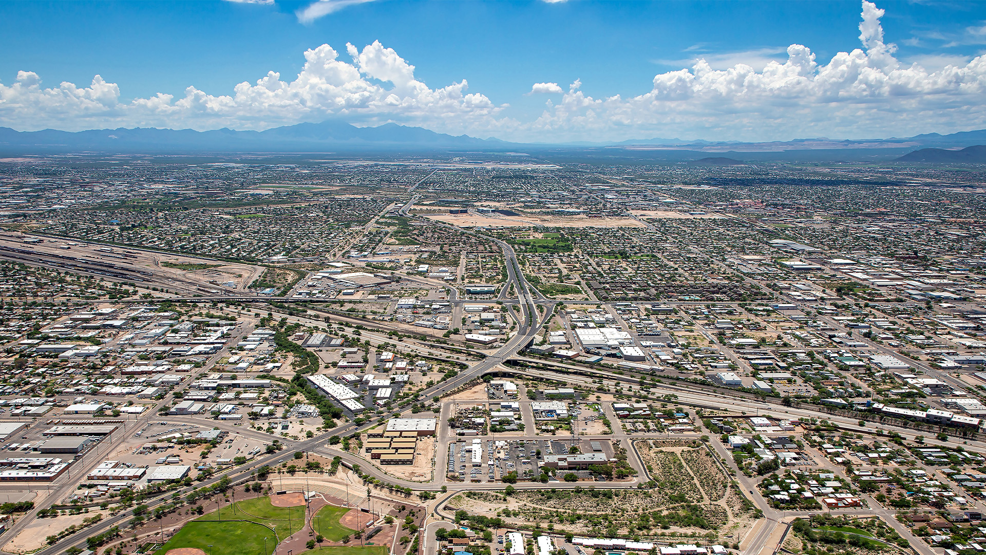 Aerial view of the city with mountains in the distant background